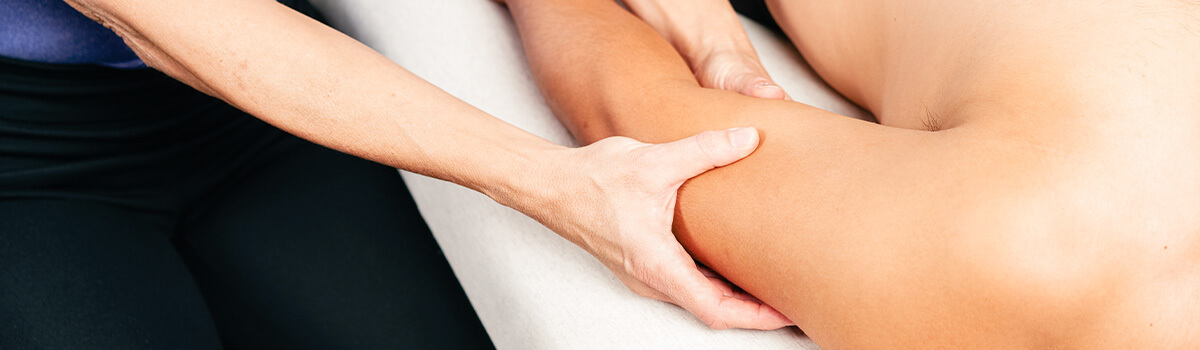 The hands of a certified Rolfer performing part of the Ten Series during a Rolfing Structural Integration session.